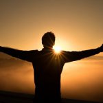 Success - silhouette photo of man on cliff during sunset