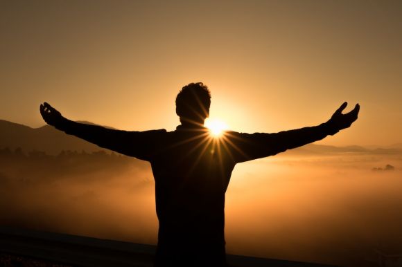Success - silhouette photo of man on cliff during sunset