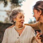 Values-happiness Relationship - Joyful adult daughter greeting happy surprised senior mother in garden