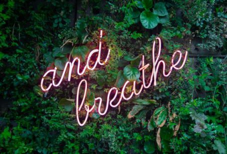 Self-care - and breathe neon sign on tre