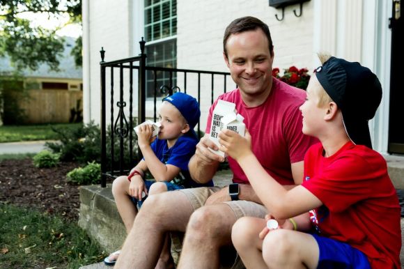 Family - A father and his two boys enjoy drinking Boxed Water