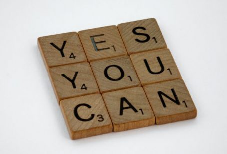 Self Confidence - brown wooden blocks on white surface