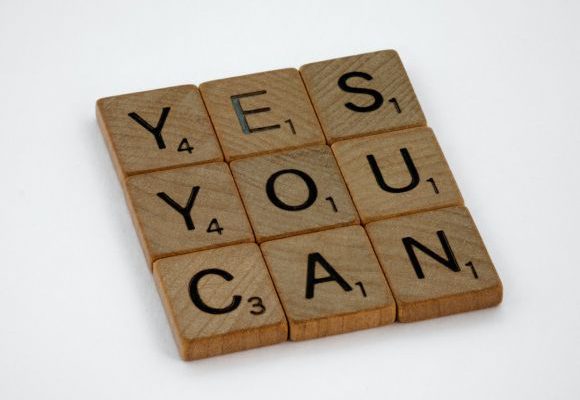 Self Confidence - brown wooden blocks on white surface