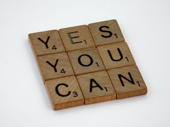 Self Confidence - brown wooden blocks on white surface