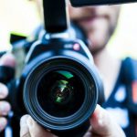 Productive Action - Person Holding Canon Dslr Camera Close-up Photo